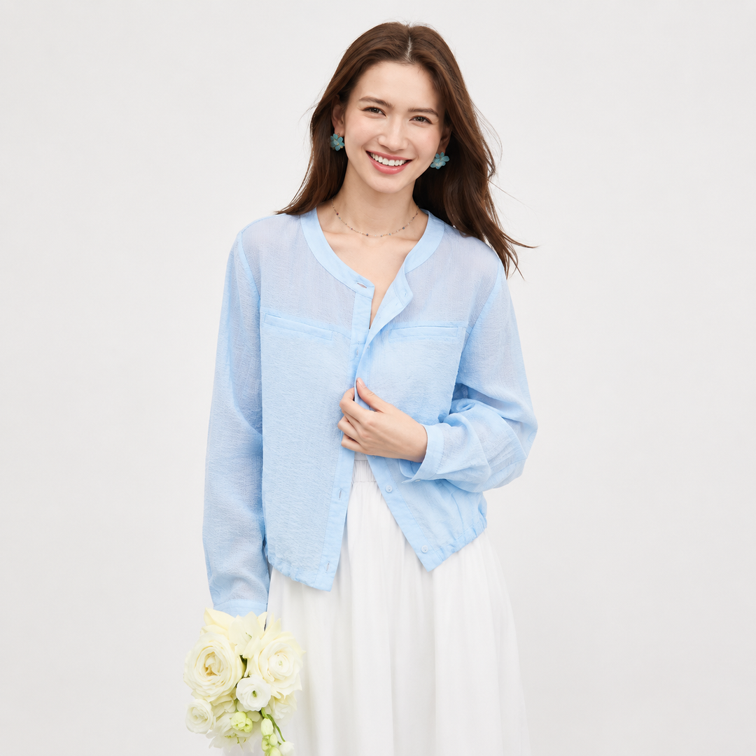 Oversized dame topp med justerbare lange ermer. Luftig, transparent sommertopp i elegant casual stil med rund hals.