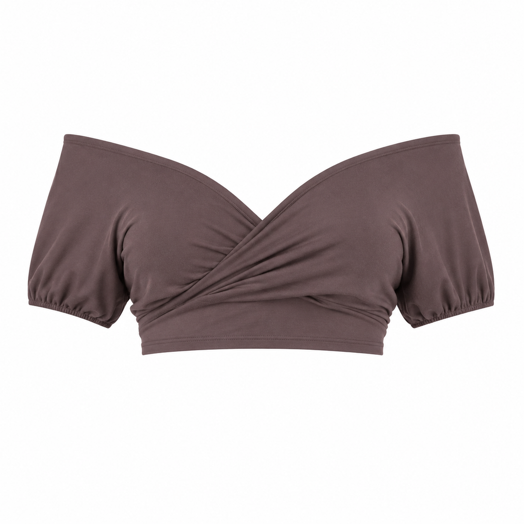 Flott off-shoulder croptop i blå med iøynefallende åpen rygg og knyting, en trendy festtopp.