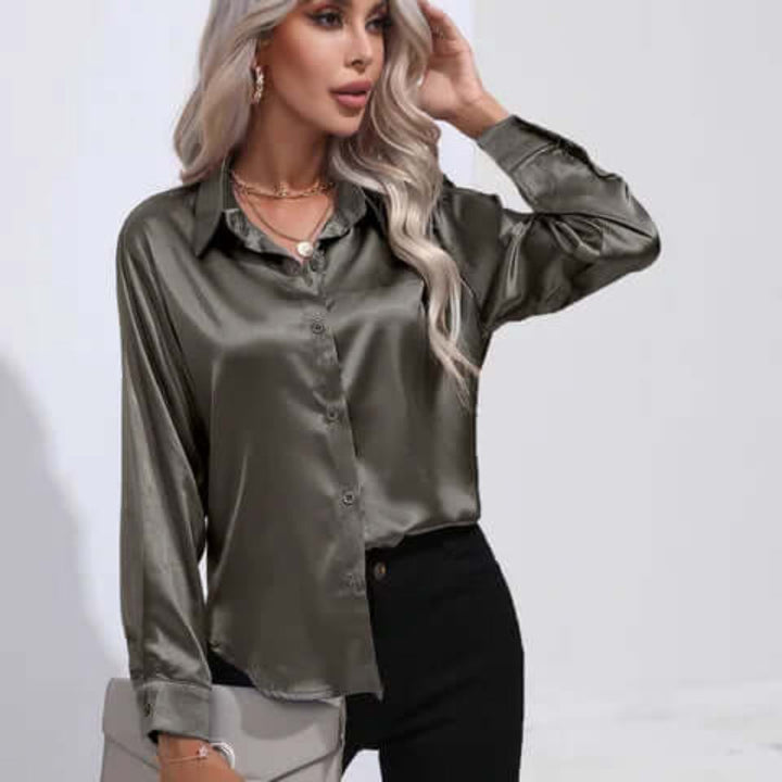 Kontorantrekk: elegant damebluse, løs passform, lange ermer, profesjonell stil.