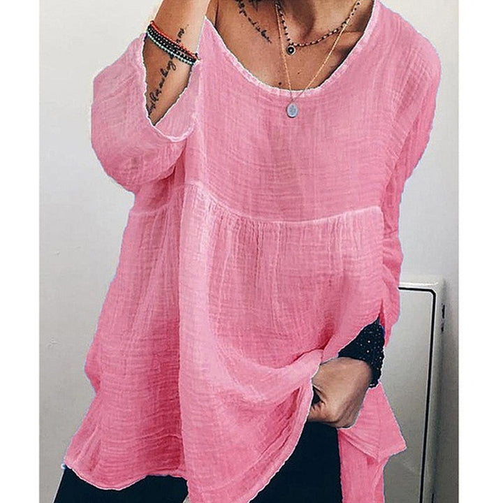 Allsidig ensfarget kvinnebluse med lange ermer, lett å style for enhver anledning.
