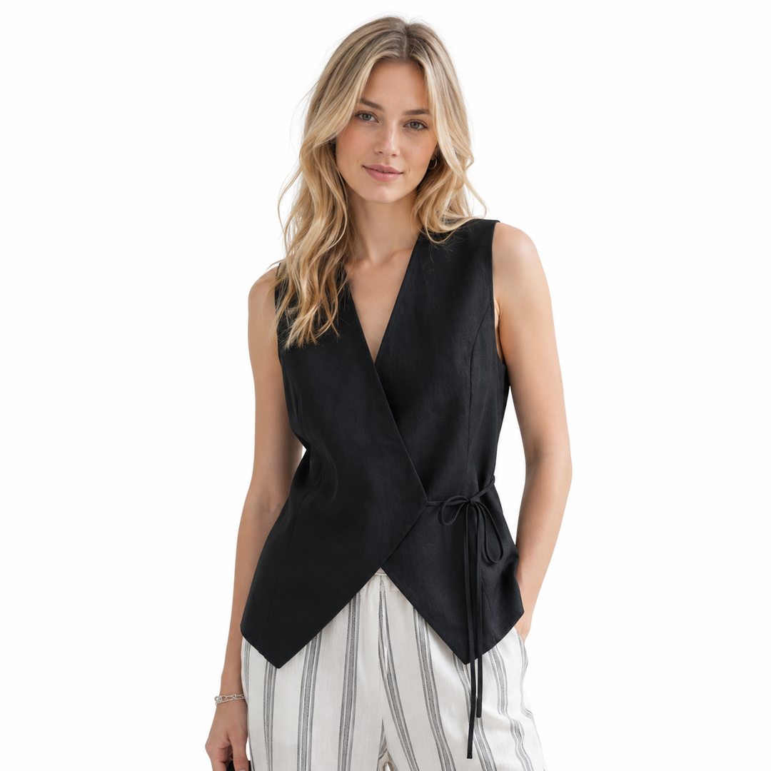 Stilig ermeløs dame topp i vintage fransk stil. Perfekt V-hals vest med knytedetalj for sommer og kontor.