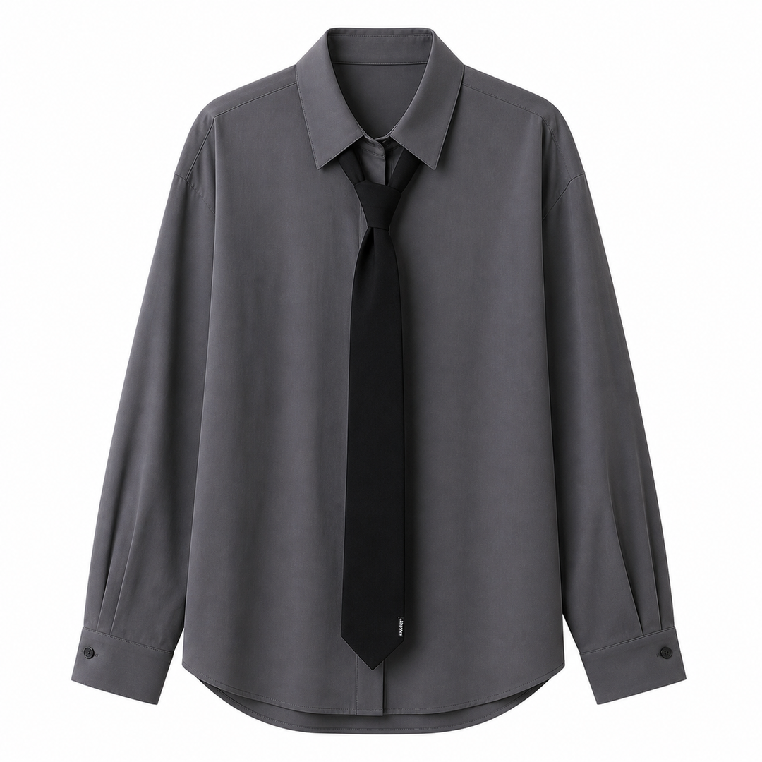Komfortabel grå oversized damebluse med langermet knytekrage, ideell for elegant hverdags- og kontorantrekk.