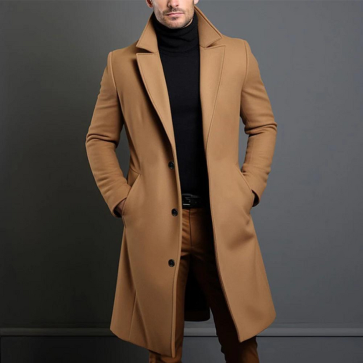 Klassisk herre ullfrakk i ullblanding for elegant stil og varme på kjølige dager. Perfekt yttertøy for menn.