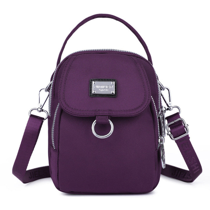 Fargerik og vanntett crossbody-veske, det perfekte tilbehøret for stilbevisste kvinner.