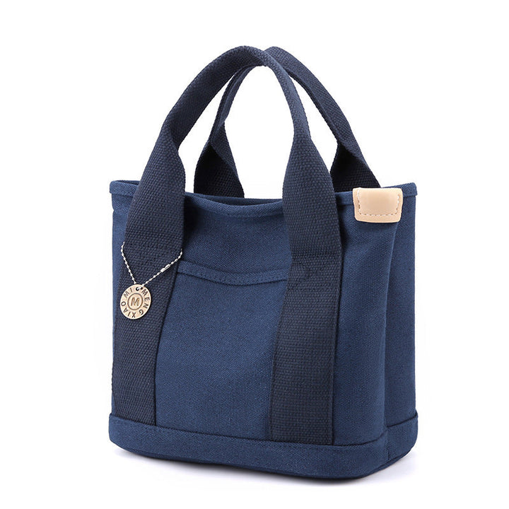 Stor kapasitet canvas shopper for kvinner, med intern organisering.