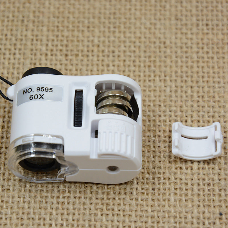 Miniatyr mikroskop med 60x forstørrelse, ideelt for små detaljer og oppdagelser.