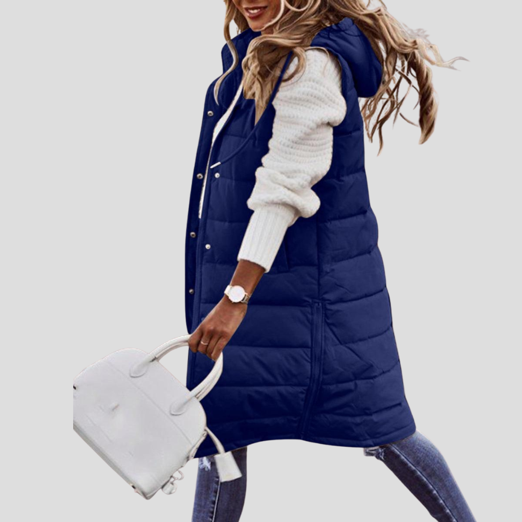 Stilig lang bodywarmer for kvinner med hette. Flerfarget damevest, moderne yttertøy som passer til fritid.