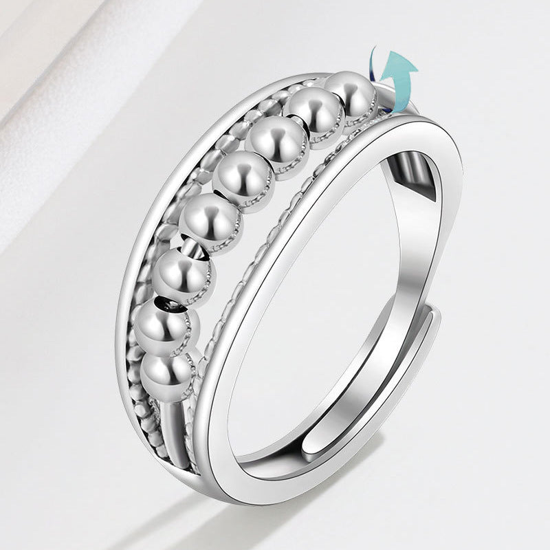 Unisex fidget ring i platina med roterende perler mot angst og stress.