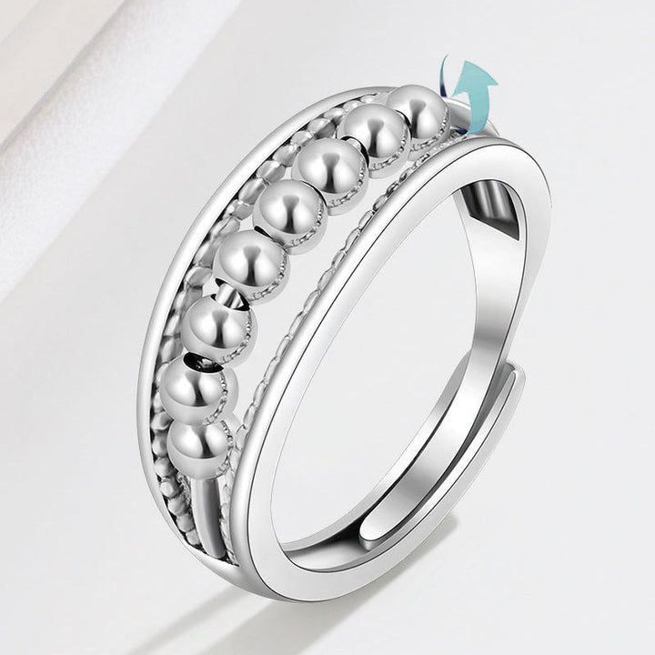 Unisex fidget ring i platina med roterende perler mot angst og stress.
