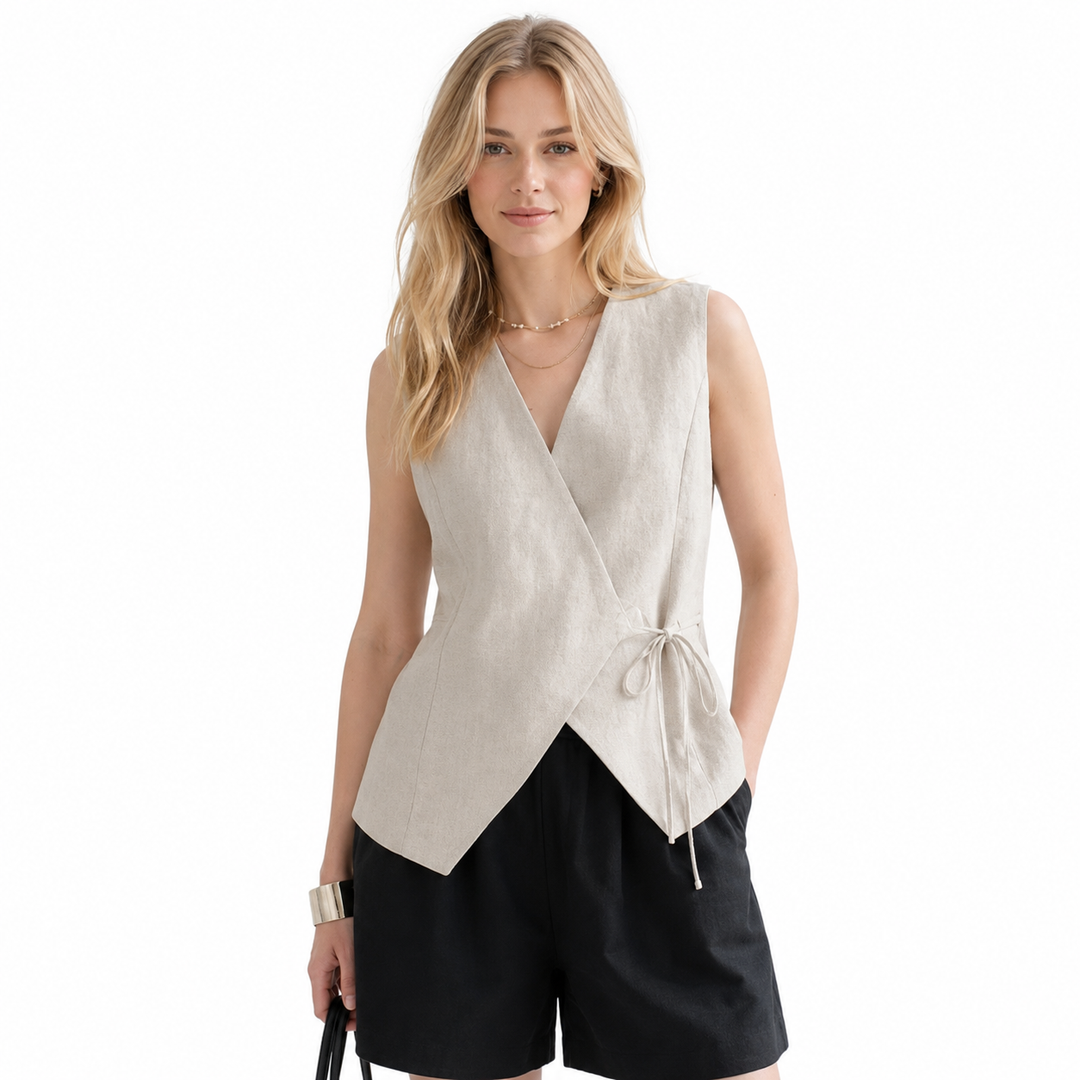 Dame ermeløs V-hals topp med vintage knytedetalj. Fransk inspirert vest for sommer og kontor.
