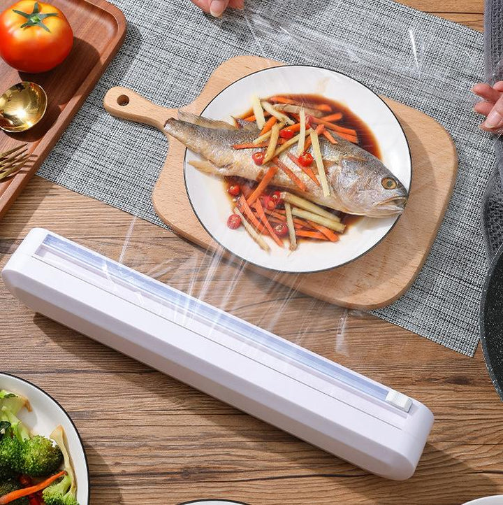Smart foliedispenser som holder plastfolie og aluminiumsfolie organisert. Perfekt for effektiv matoppbevaring.