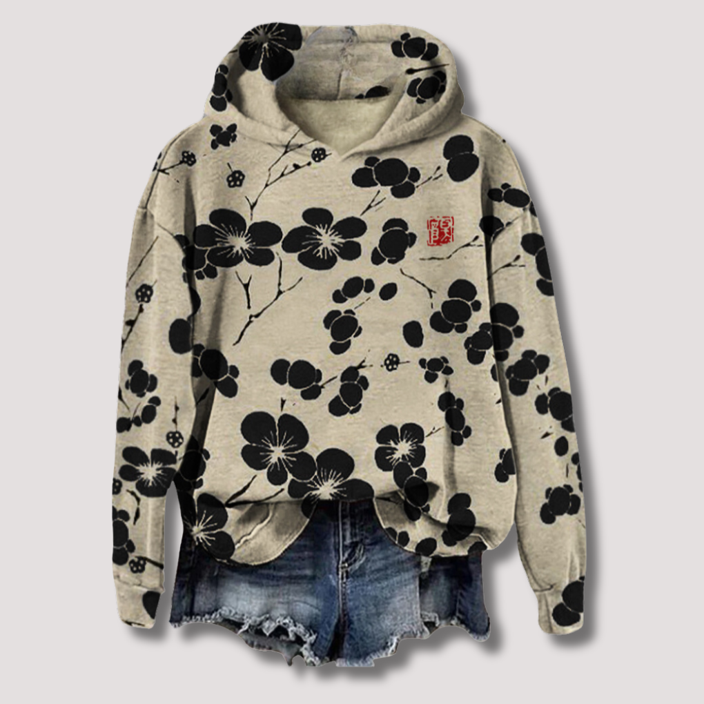 Lett dame hettegenser med trendy blomstertrykk. Komfortabel og pustende for sommerdager.