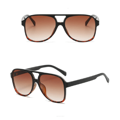 Unisex vintage aviator solbriller, sideprofil viser elegant ramme i polykarbonat.