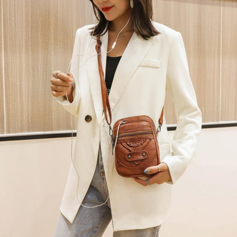 Allsidig crossbody-veske i vegansk skinn, brun. Elegant, vanntett og kompakt for dame.