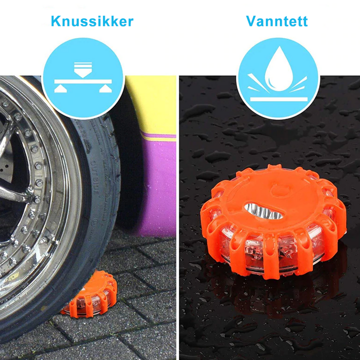 Bilist bruker magnetisk nødlys ved en punktering, øker synligheten og tryggheten ved veien.
