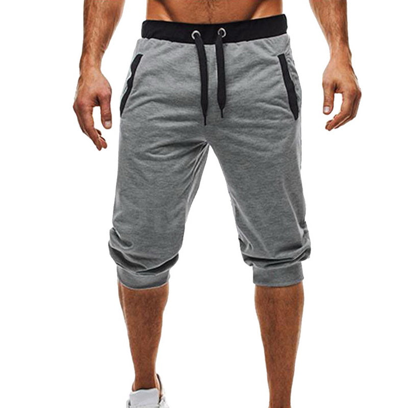 Elastiske polyester treningsbukser for menn med snøring, gir optimal bevegelsesfrihet under aktivitet.