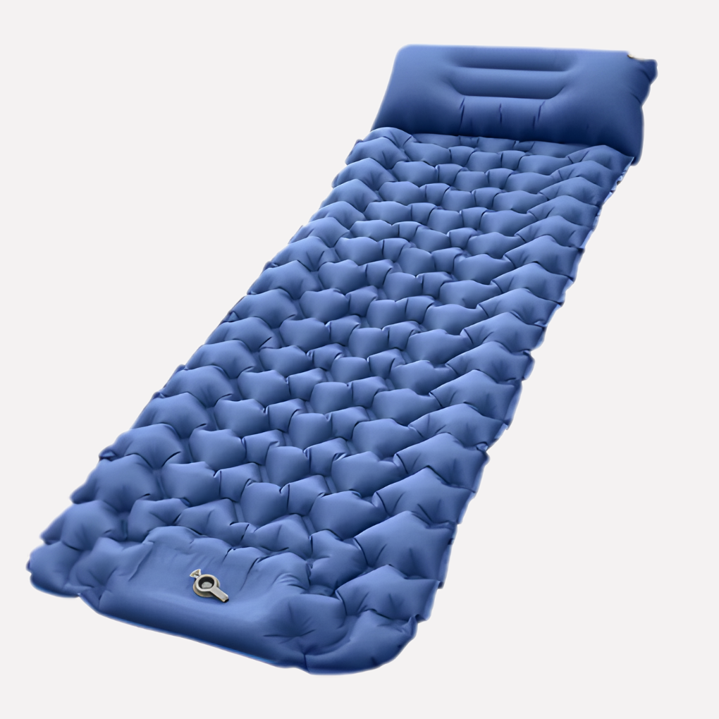 Kompakt soveunderlag utslått på bakken, klar for optimal hvile under telttur, camping og utendørs.