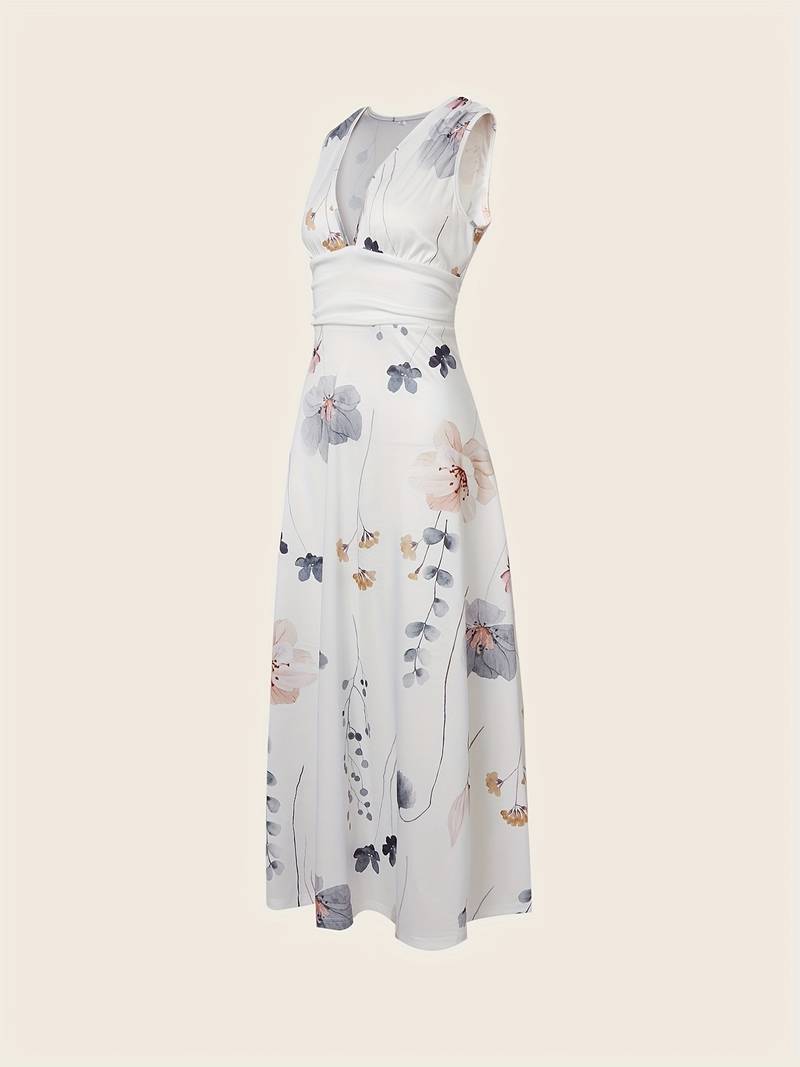 Lang damekjole med elegant blomstertrykk, perfekt for sommerfest. En nydelig maxikjole med lett stoff.