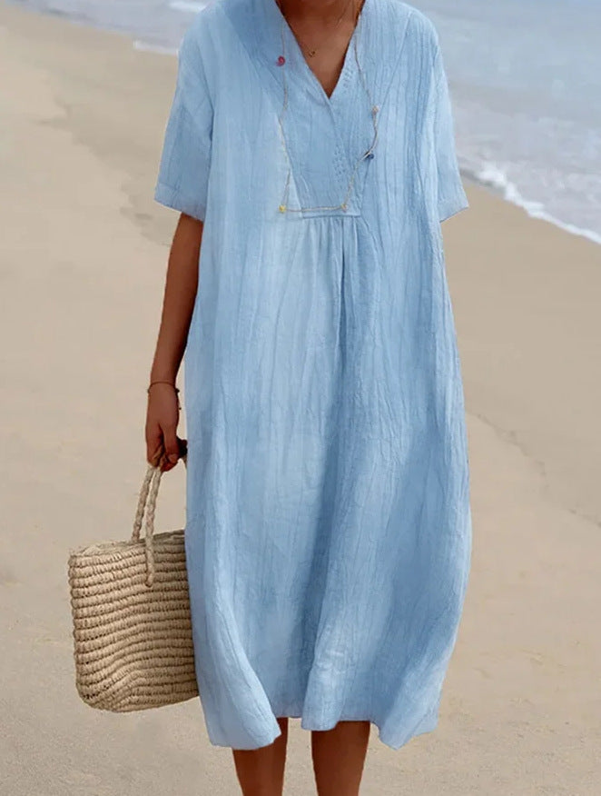 Chic og avslappet sommerkjole med V-hals for dame, en lett og komfortabel strandkjole.