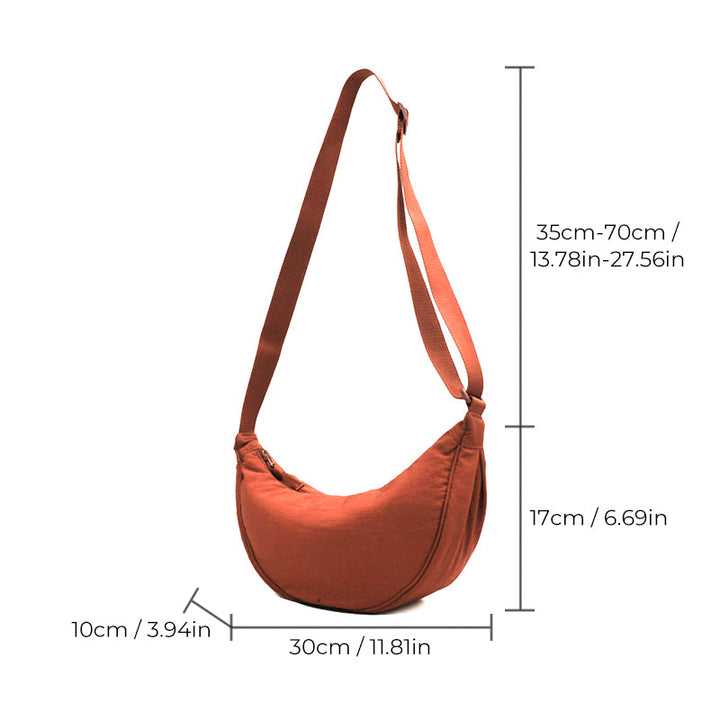 Dame halvmåne skulderveske i elegant design. Ideell som crossbody-veske for hverdag.