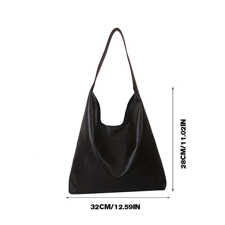 Brun skinnimitasjon messengerbag for dame, slitesterk og elegant hverdagsvske med stil.