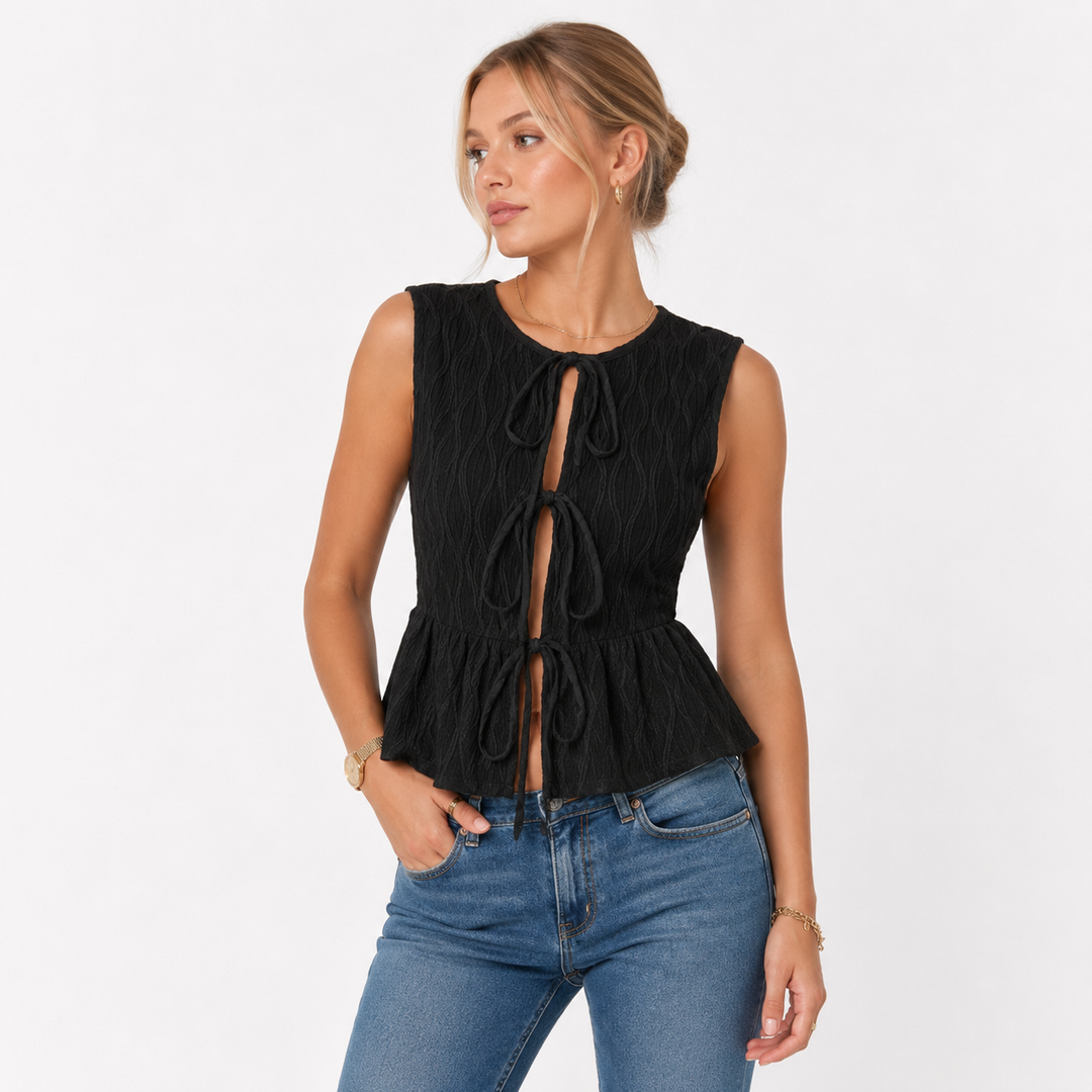 Allsidig ermeløs dametopp med rund hals. Ideell casual knytetopp for sommer og fritid, elegant og behagelig.