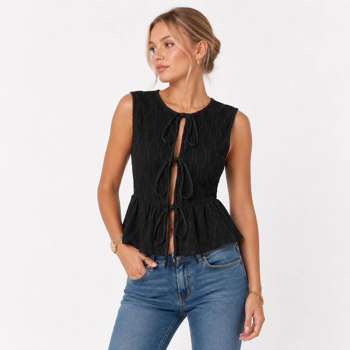 Allsidig ermeløs dametopp med rund hals. Ideell casual knytetopp for sommer og fritid, elegant og behagelig.