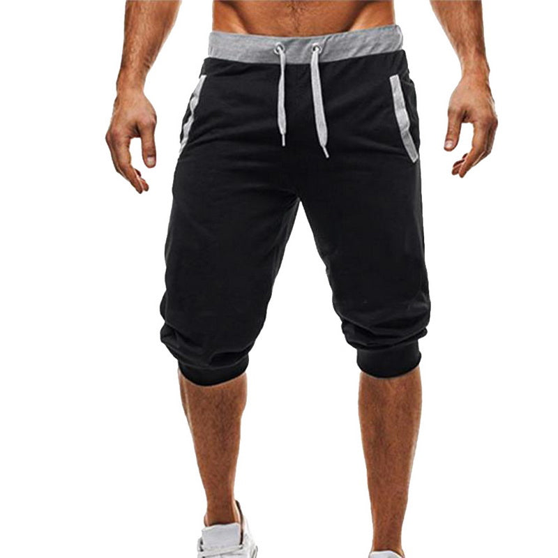 Menns sportsbukser med snøring, perfekte for trening og fritid, i elastisk polyesterstoff.