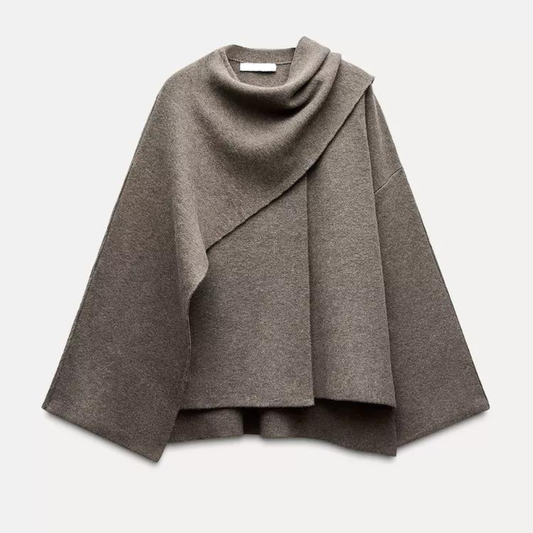 Stilfull kvinners cape frakk, perfekt for elegant lagvis antrekk. Mote ytterplagg for vinter og høst.