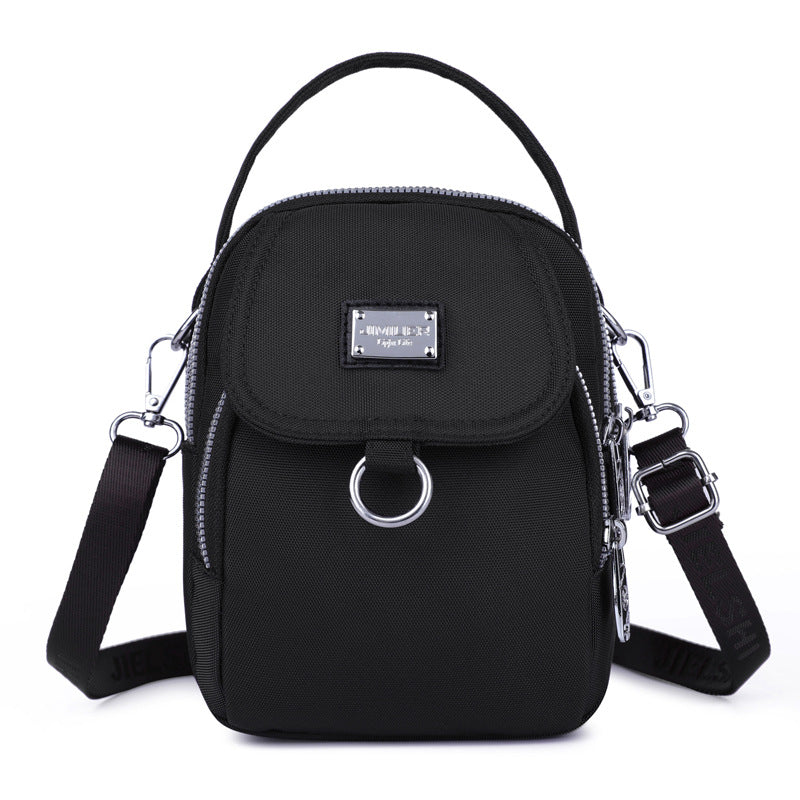 Stilfull vanntett håndveske/crossbody for kvinner, med moderne design og glidelås.