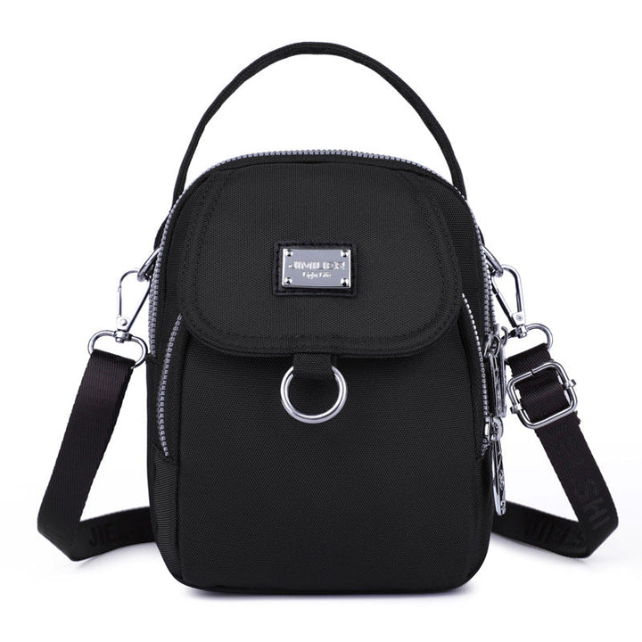 Stilfull vanntett håndveske/crossbody for kvinner, med moderne design og glidelås.