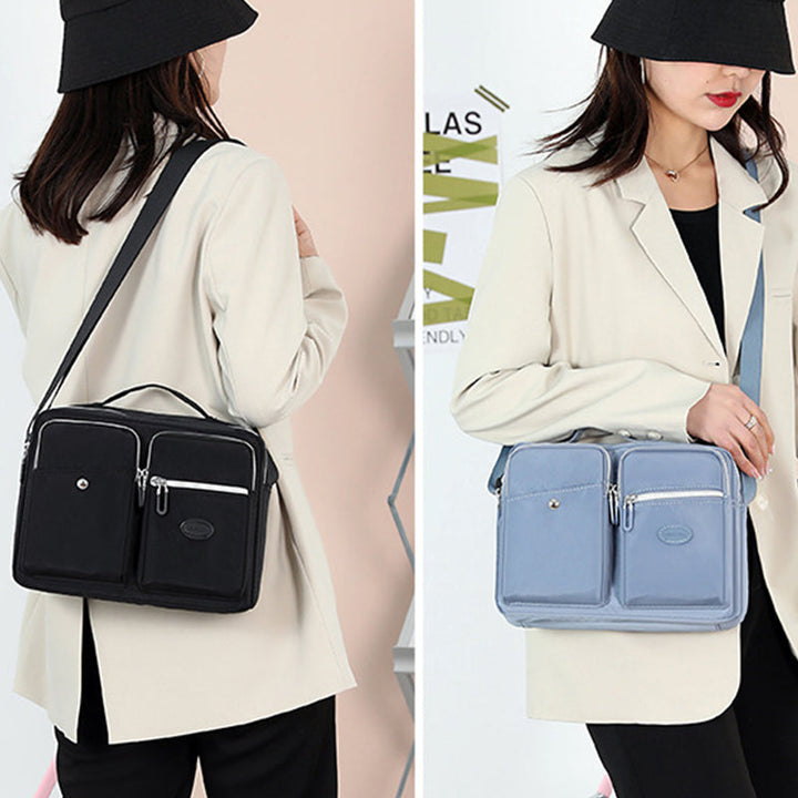 Praktisk dame messenger bag i slitesterk nylon for organisert oppbevaring.