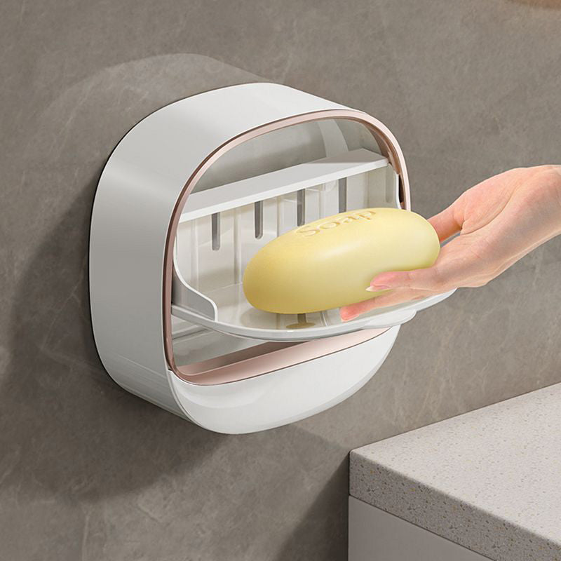 Vanntett såpeholder med drenering, perfekt for baderom. Veggmontert design i plast.