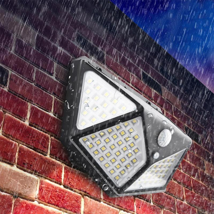 Utendørs solcelledrevet vegglampe med bevegelsessensor. Vanntett 100 LED sikkerhetslys til hage.