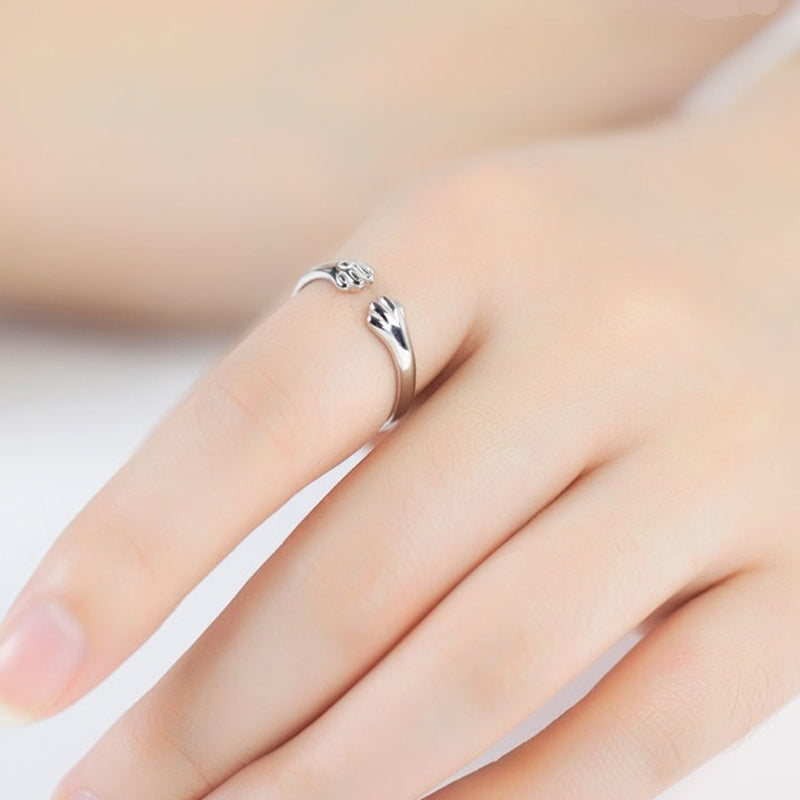 Søt dyrepoteavtrykk ring, justerbar og unisex. Et sjarmerende smykke i legering for kjæledyrelskere.