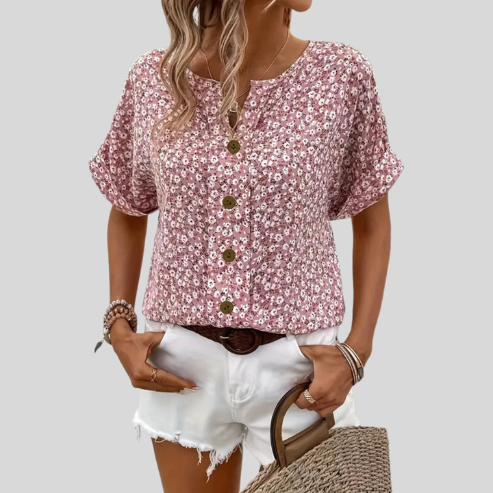 Blomstrete sommertopp for kvinner med knapper, ideell for ferie og hverdag. Elegant, lett og mønstret design.