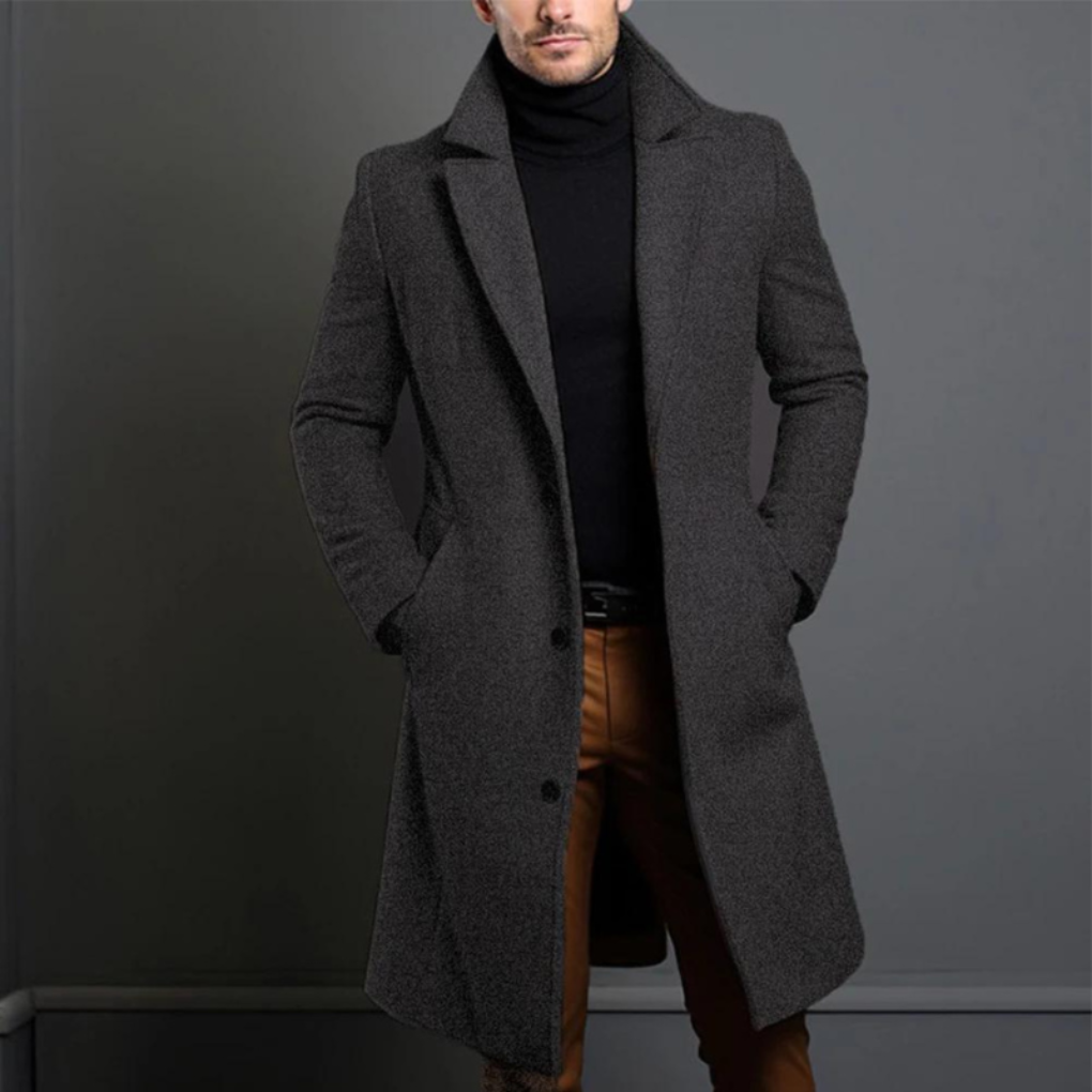 Tidløs herre ullfrakk i mørk ullblanding, ideell for både business og casual bruk. Varm vinter- og høstjakke.