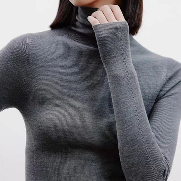 Minimalistisk ensfarget strikket topp, høy hals, langermet, elegant og allsidig for kvinner.