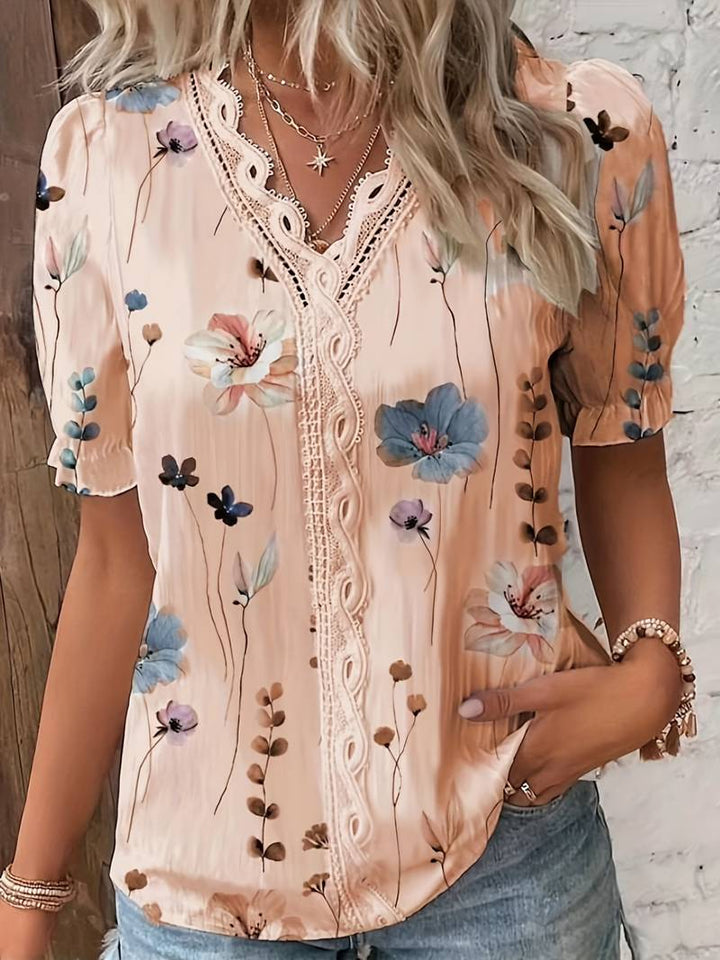 Komfortabel elegant damebluse med dyp V-hals, ideell for en stilig og avslappet look.