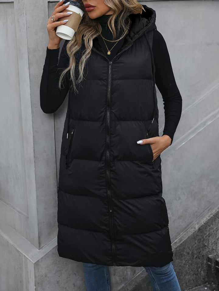 Slank lang hettevest for dame i svart polyester, moderne og funksjonell gilet, perfekt for sesongoverganger.