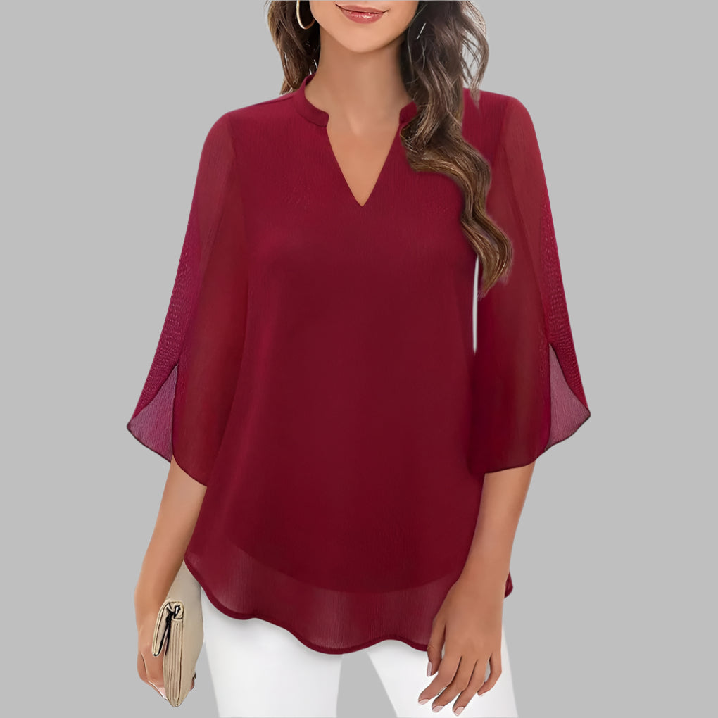 Stilfull dametopp med v-hals og kronbladermer, ideell for sommer. Elegant hverdag eller fest bluse.