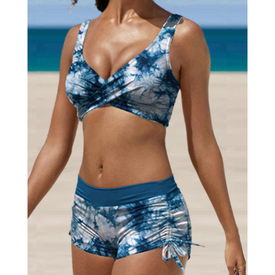 Komfortabel to-dels badedrakt for kvinner. Høytlivs bikini ideell for sommer, strand og basseng. Myk og støttende.