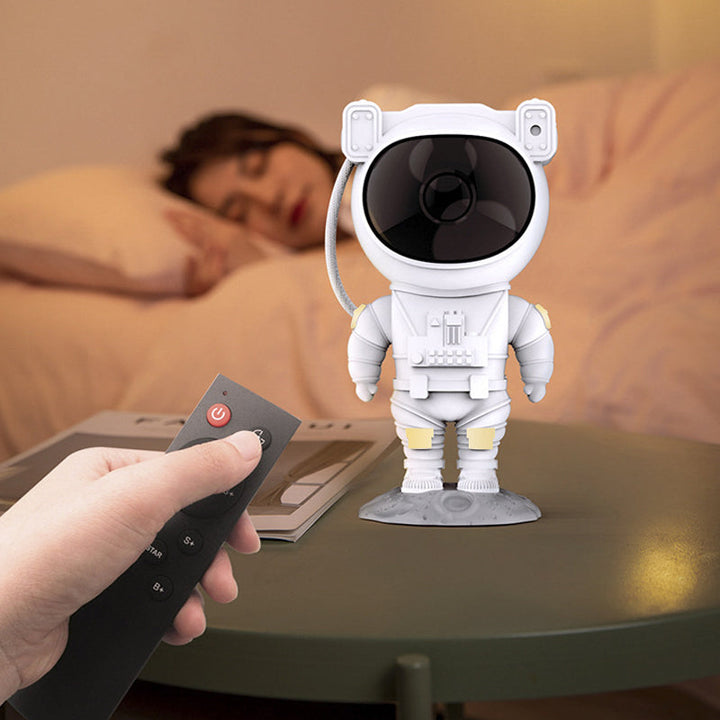 Astronautfigur med justerbart hode som projiserer galakse og stjerner.