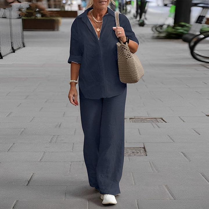 Kvinner langermet bluse og vide bukser. Ensfarget fritidsdress for hverdagsstil og vårklær.