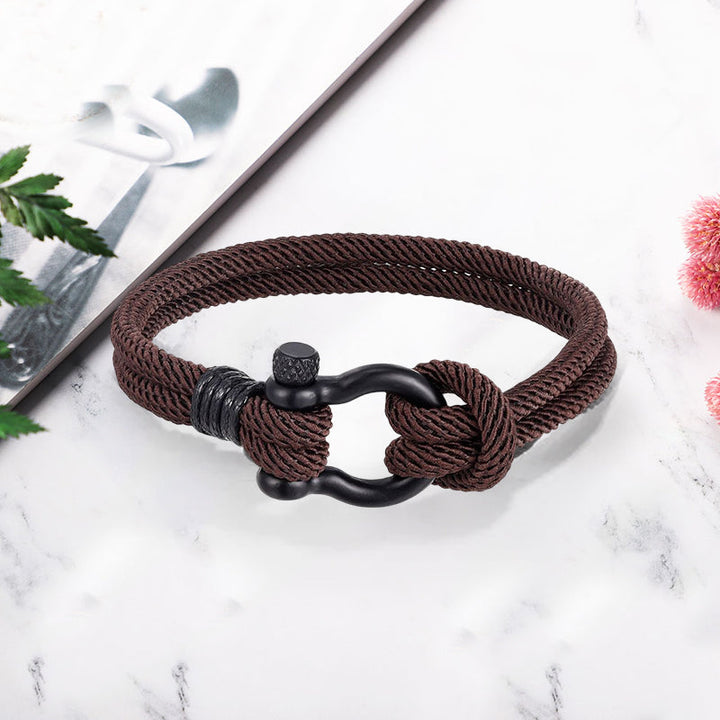 Robust flettet unisex tauarmbånd med nautisk anker, slitesterkt og stilrent.