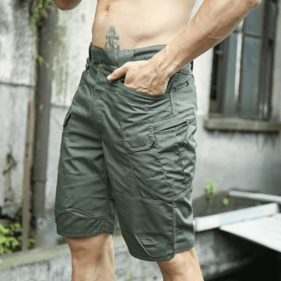 Sidevisning av herre cargo shorts, fremhever praktiske sidelommer; vanntett og slitesterk for tur.