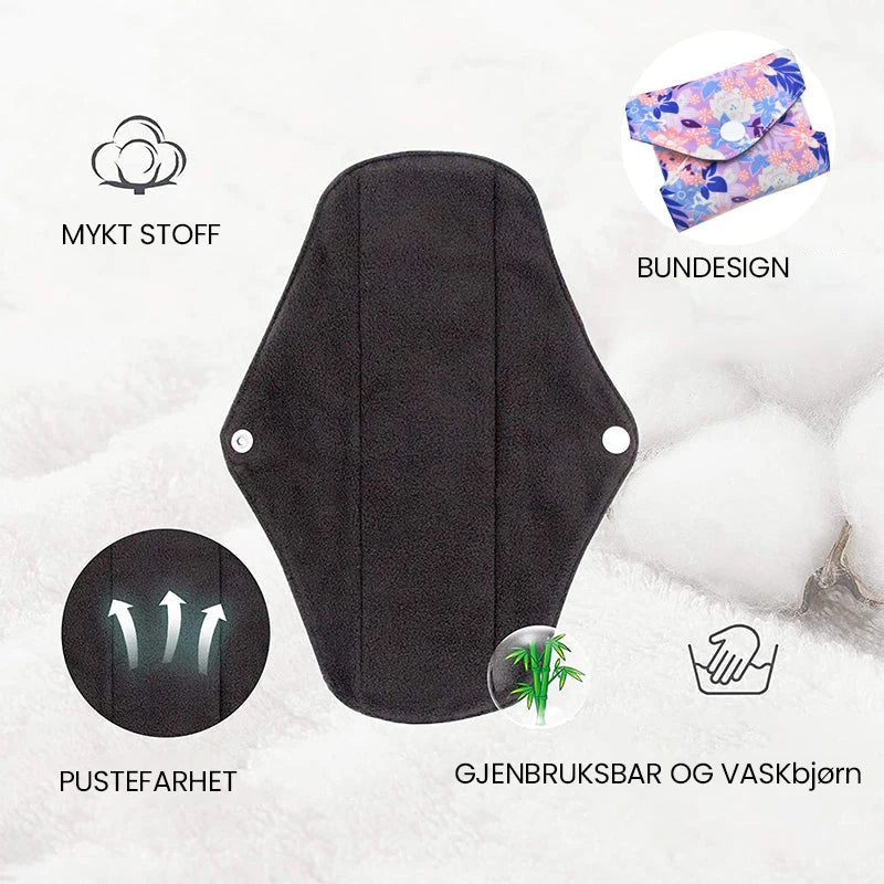Sammenfoldede gjenbrukbare sanitetsbind av bambuskull, praktisk og diskret menstruasjonsbeskyttelse.
