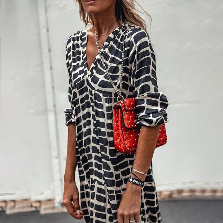 Lekker langermet leopard maxikjole med V-hals. Elegant og komfortabel vår-/sommerkjole for kvinner.