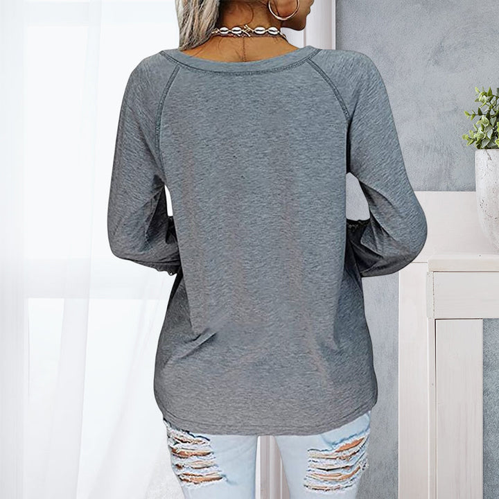 V-hals blondetopp, langermet ensfarget bluse for kvinner.