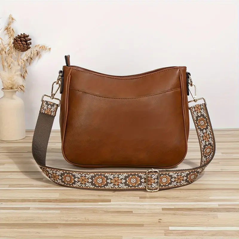 Stilfull vegansk dame skulderveske i bærekraftig PU-lær, en miljøvennlig crossbody løsning.